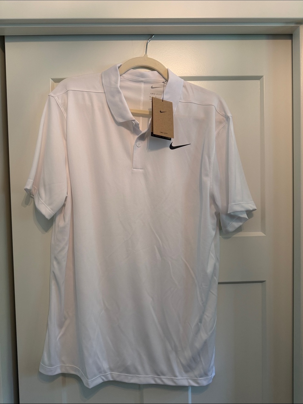 Nike golf Men's White Polo with Black Swoosh